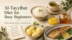 Featured image for an Al-Tayyibat Diet for busy beginners article showing simple meals with white rice, potatoes, ghee, honey, green tea, fish, and an easy prep checklist.