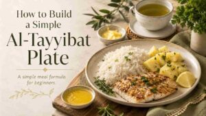 Featured image for an article about how to build a simple Al-Tayyibat plate, showing rice, potatoes, grilled fish, ghee, green tea, herbs, and pure beginner-friendly foods.